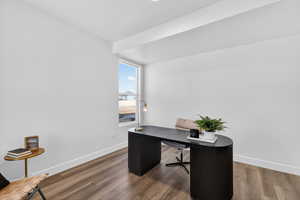 Office area with wood finished floors and baseboards