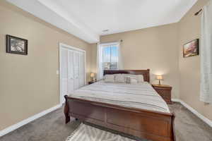 Bedroom with carpet floors and a closet
