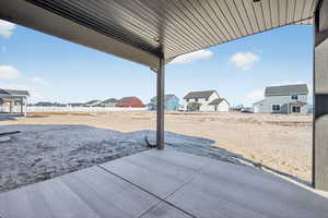 View of yard featuring a patio area and a residential view