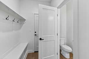 Mudroom with dark wood-style flooring