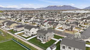 Aerial overview of property's location with mountains and nearby suburban area