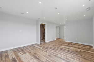 Unfurnished room with light wood finished floors and recessed lighting