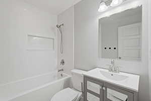 Bathroom featuring vanity and bathing tub / shower combination