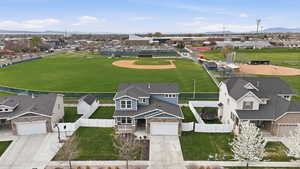 Aerial perspective of suburban area with a mountain backdrop