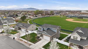 Aerial perspective of suburban area featuring a mountain backdrop