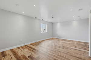 Unfurnished room featuring light wood-type flooring and recessed lighting