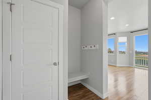 Mudroom featuring light wood-style flooring and recessed lighting