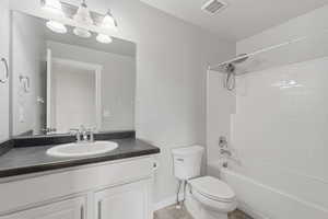 Bathroom with vanity and bathtub / shower combination