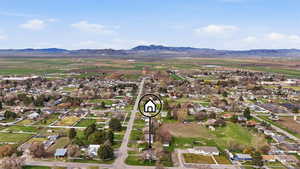 Aerial perspective of suburban area with a mountainous background