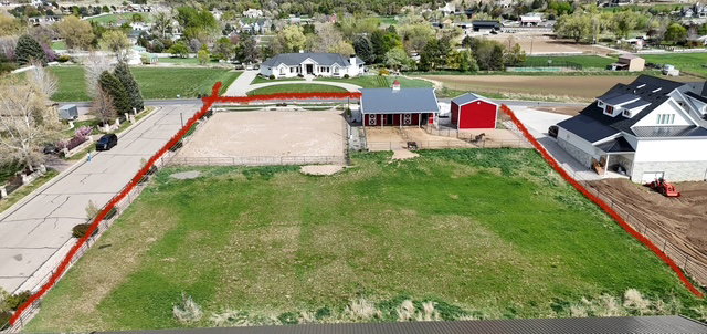 Aerial view of residential area with property parcel outlined