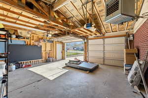 Garage with a heating unit and a garage door opener
