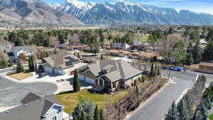 Aerial perspective of suburban area featuring a mountain backdrop