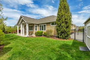 Back of property featuring a patio area and roof with shingles