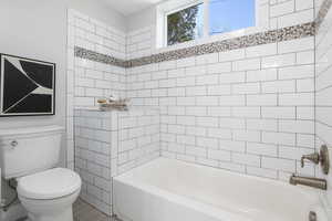 Full bath with toilet and  shower combination
