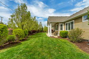 Fenced backyard with a patio