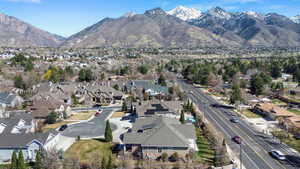 Aerial view of residential area featuring a mountainous background