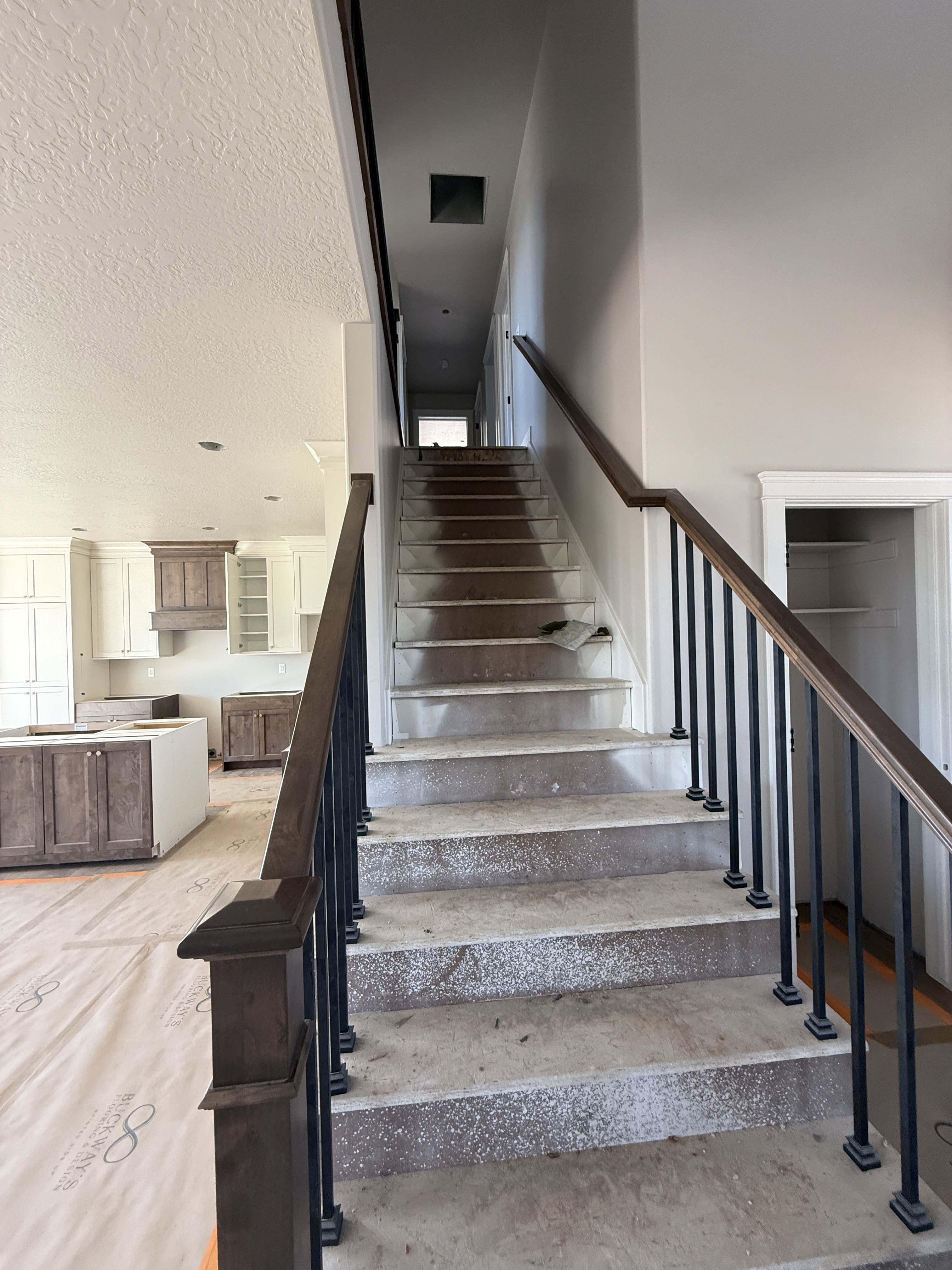 Staircase with a textured ceiling