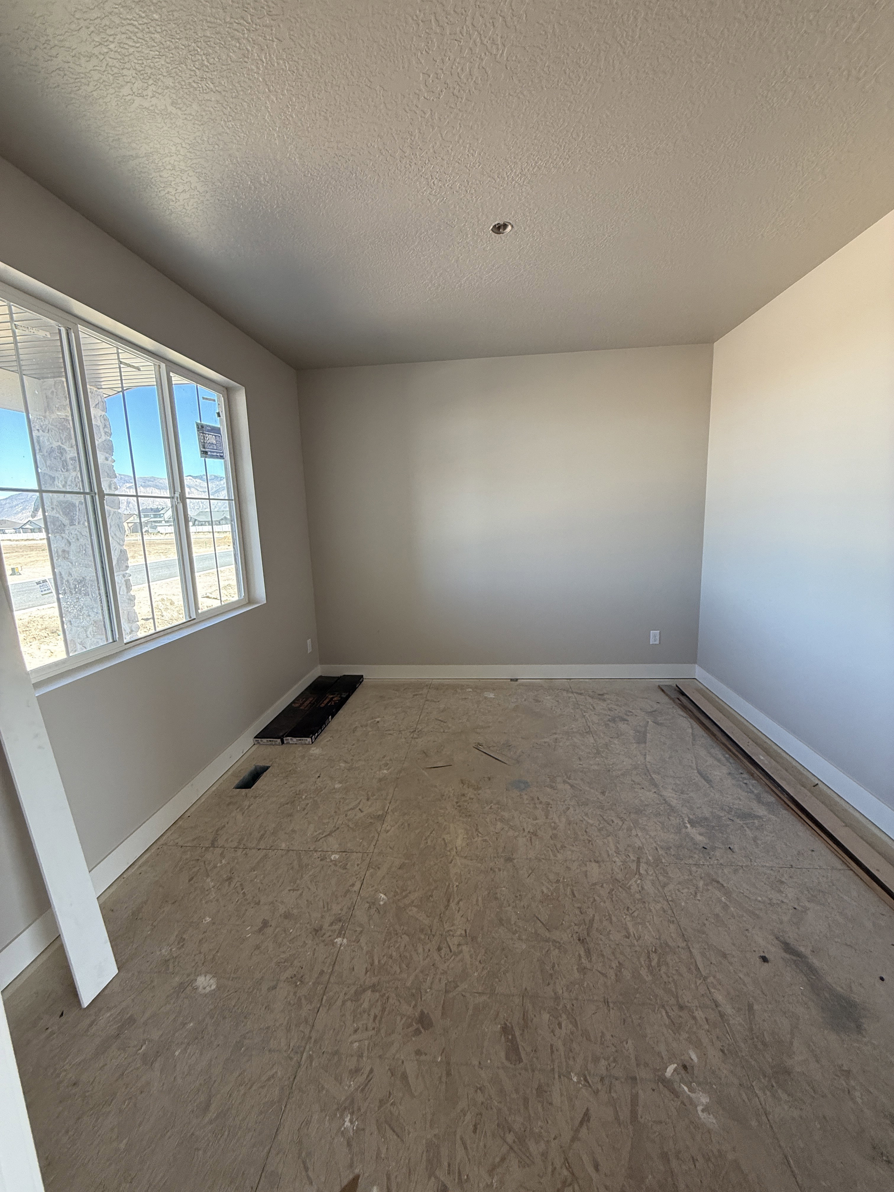 Spare room featuring a textured ceiling