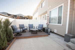 Fenced backyard featuring a deck and a patio area