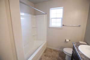 Full bathroom with vanity and bathing tub / shower combination