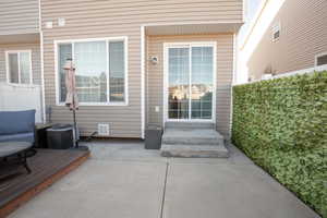 Property entrance with a patio area