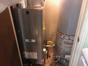 Utilities featuring water heater and heating unit