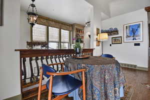 Dining space featuring dark wood finished floors