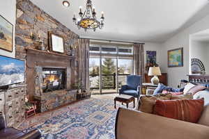 Living area with a fireplace and hanging lights