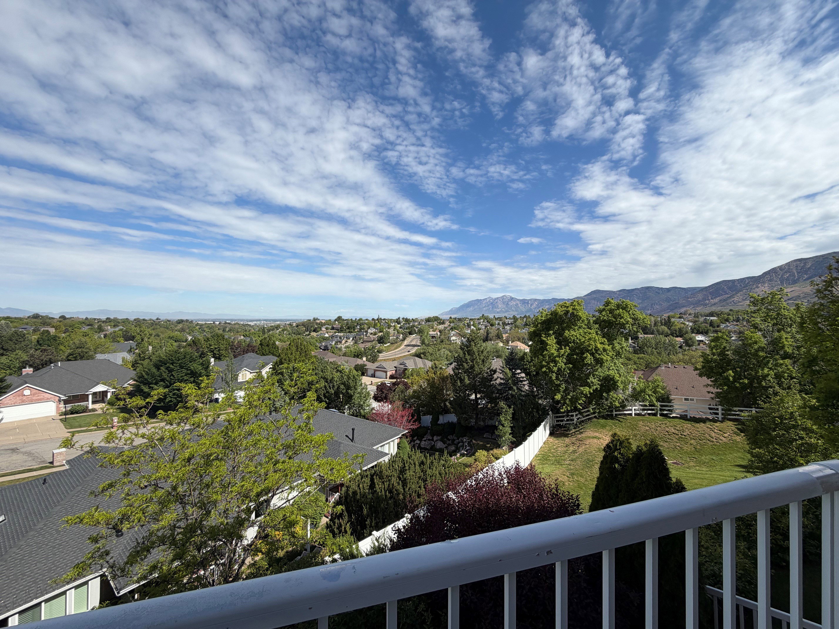 Expansive territorial scenery featuring distant mountains and a broad horizon