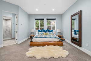 Carpeted bedroom with baseboards and recessed lighting
