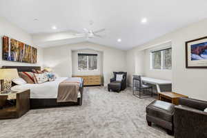 Bedroom featuring light colored carpet, ceiling fan, and recessed lighting