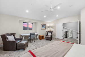 Bedroom with light carpet, ceiling fan, recessed lighting, and vaulted ceiling