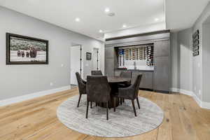 Dining space with recessed lighting and light wood finished floors