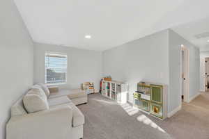 Living room with carpet and baseboards