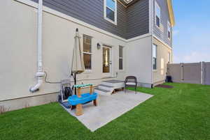 View of patio featuring a gate