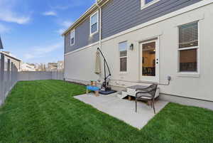 Fenced backyard featuring a patio