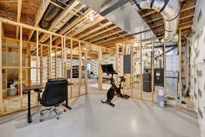 Unfinished basement featuring electric panel