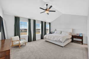 Bedroom with ceiling fan and light colored carpet