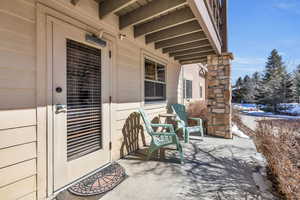 Snow covered patio with covered porch