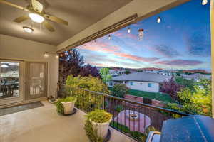 Balcony at dusk with a ceiling fan