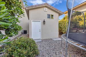 View of outbuilding with a trampoline