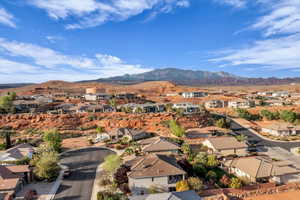 Aerial perspective of suburban area with a mountain backdrop