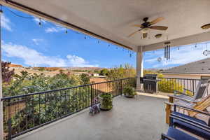 Balcony with a ceiling fan and grilling area