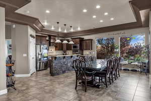 Dining area featuring baseboards and recessed lighting