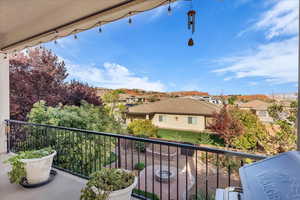 Balcony with a residential view and area for grilling