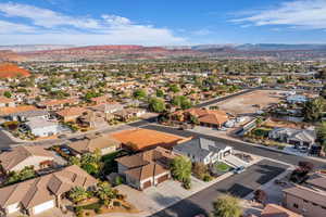 Aerial view of residential area featuring a mountainous background