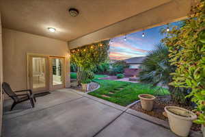 Fenced backyard featuring a patio