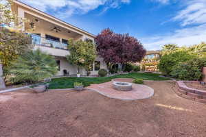 View of community with a patio, an outdoor fire pit, and a balcony