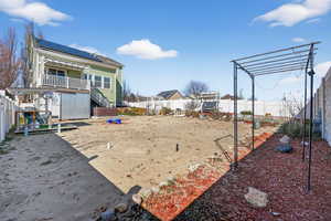 Fenced backyard with stairs