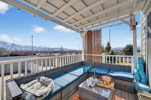 Balcony with an outdoor hangout area and a mountain view